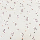 Baumwolljersey - mit kleinen Hasen und zarten Blumen - naturweiß - Stoffmeisterei